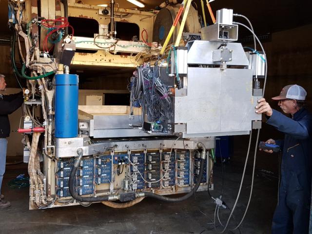 Loading the flyash container on the arm